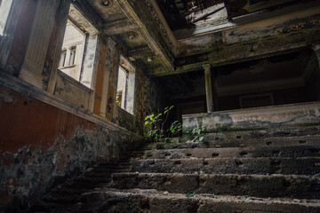 Fototapeta na wymiar Old abandoned ruined stage theater or cinema hall