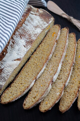 A loaf of brown bread with grains of cereals