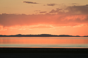 sunset in red and orange over the great salt lake, utah - 559413729