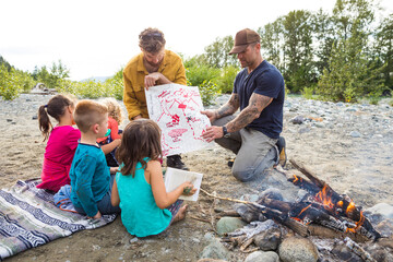 Two men with children and treasure map