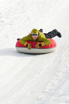 A boy goes snow tubing at Snow King Mountain in Jackson, Wyoming.