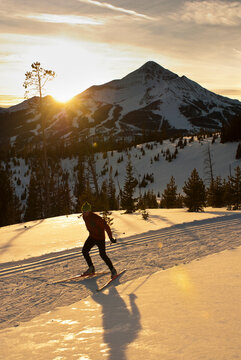 A young man nordic skate skis at Lone Mountain Ranch in Big Sky, Montana.