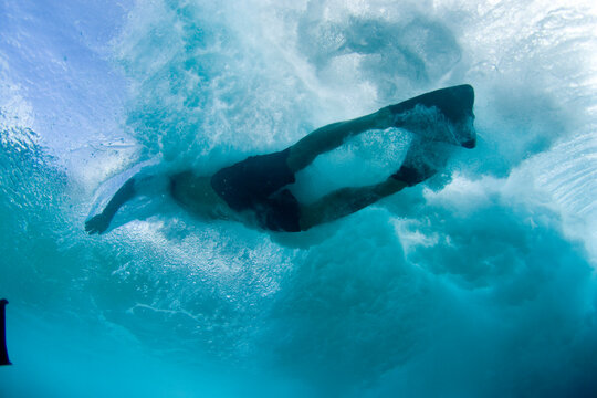 underwater picture of man bodysurfing in Hawaii