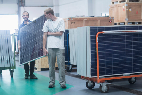Store workers working in a distribution warehouse, Freiburg im Breisgau, Baden-Württemberg, Germany