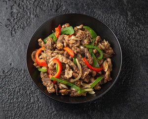 Crispy Salt and Pepper Beef in black bowl