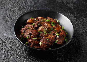 Fried chicken liver, poultry meat food with herbs
