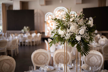 Luxury wedding table setting with flower centerpieces and candles