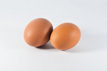 raw chicken eggs on a white background