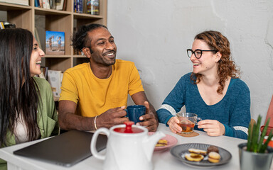 Young friends hangout in coffee shop, multiracial universitary student having fun at breakfast,...