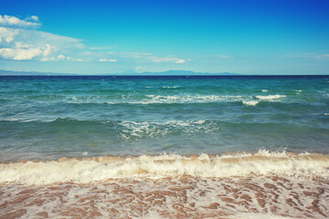 Seascape on a sunny day, view of sunny bay in Aegean sea in Chalkidiki, Greece