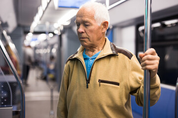 Portrait of man traveling in subway train during daily