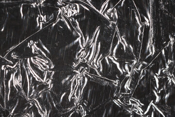 crumpled foil abstract background black and white silver effect