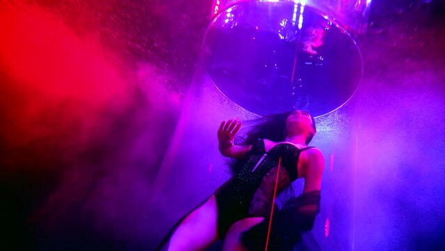delightful female figure floating in deepness of pool, underwater slow motion shot with sexy lady