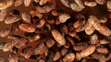 Cocoa beans flying in the air in freeze motion.