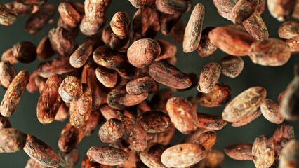 Cocoa beans flying in the air in freeze motion.
