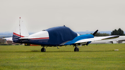 Twin engined classic light aircraft. Dating from the 1950's with winter protection for canopy and engines.