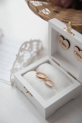 close-up of wedding rings in a wooden box