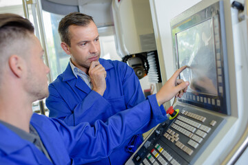 Technician identifying problem to his superior