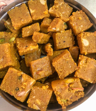 Moong dal or besan Barfi - an Indian dessert. A freshly prepared sweet dish packed with dry fruits is rich in nutrition, served during the festival, and set the mood for festivities and celebrations.