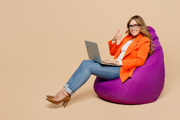 Full body young employee IT business woman corporate lawyer in classic formal orange suit glasses...