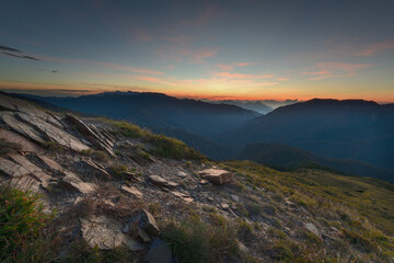 Fototapeta na wymiar sunset over the mountains and mountain layers