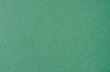 Art dark green paper textured background.