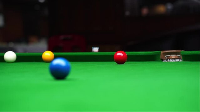 Red ball get knocked in a game of snooker