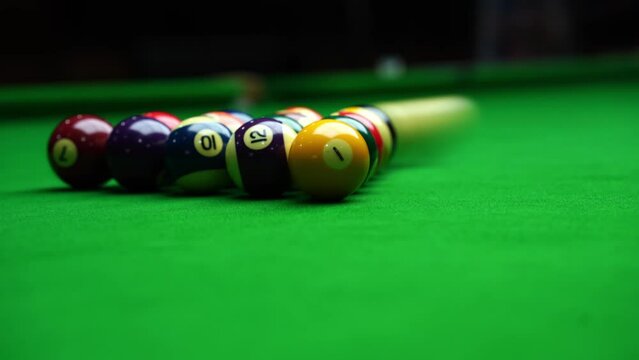 The initial blow to the pyramid of balls in Billiard