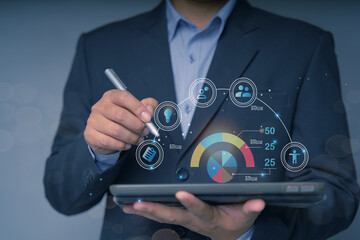 Businessman using tablet to navigate user interface UX UI futuristic graphic icon design with people outline communication and planning innovation concept teamwork strategic planning modern technology