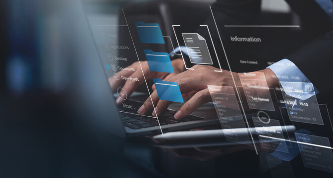 Document management system (DMS). File manager managing computer folders on laptop. Document directories on computer device. Business data and processing.