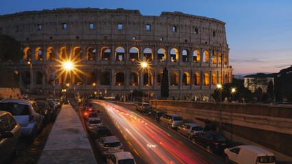 Fototapeta na wymiar ROME, ITALY - OCTOBER 06, 2018: Sunset dusk street city lights fast motion timelapse at Colosseum in Rome