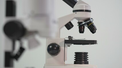 Fototapeta na wymiar Detail of hand dosing the sample on microscope plate