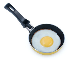 Single fried egg in very small pan with non-stick surface isolated on white background.