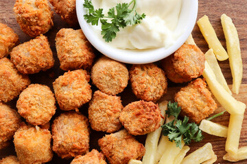 fried chicken nuggets. Chicken pops, also known as chicken popcorn with hot chips