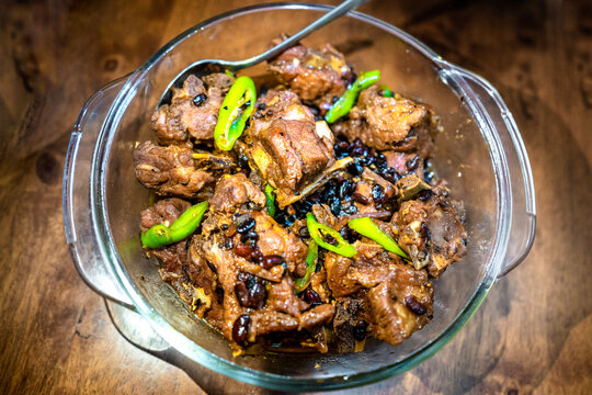 Sweet and sour pork ribs with tausi served in a bowl