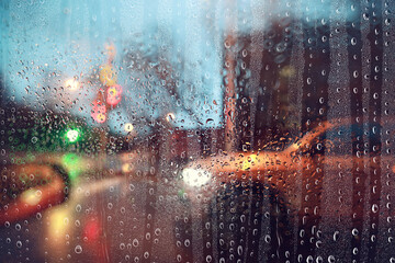 Fototapeta premium water drops window rain car traffic night, November weather