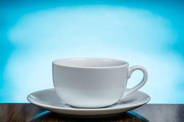 Cup of coffee on blue background