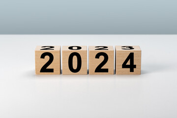 Fototapeta na wymiar 2024 New Year. Wooden blocks 2024 on neutral grey background. Start new year 2024 with goal plan, goal concept, action plan, strategy, new year business vision.