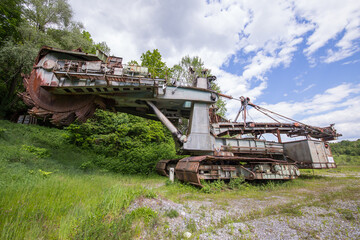 Abandoned huge coal mining digging machine parked somewhere on an old coal mine area