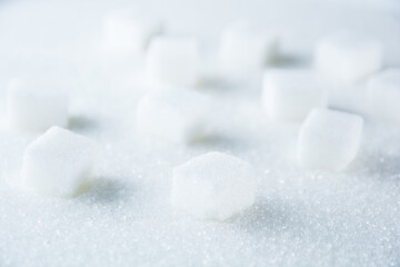 A stack of sugar cubes on a sugary surface.  - Powered by Adobe
