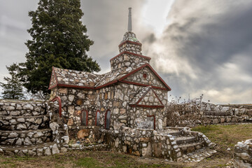Prospect Hill, NC; 01/03/2023; Photo of one of the buildings of the miniature creation of Shangrila village made of small stones and arrowheads