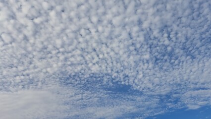 Blue sky and white clouds. Background. Texture. Selective focus. Copy space