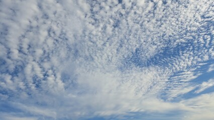 Naklejka na ściany i meble Blue sky and white clouds. Background. Texture. Copy space