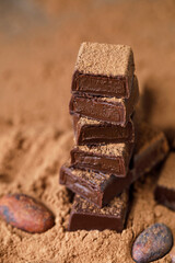 Chocolate bar with filling on brown background. Stack of dark and milk chocolate. Chocolate concept