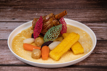 Lamb smil pie served with fried polenta, carrot, turnip, mushroom and sauce, Hight quality photo