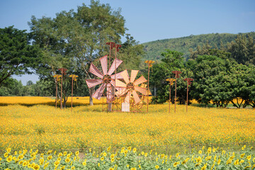 Colorful thai fabric windmill and kite at spring farm. Thailand