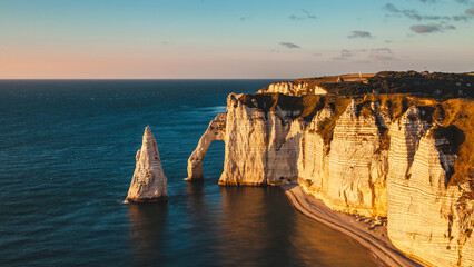 panoramic view of the white coast of etretat france at sunset - travel concept