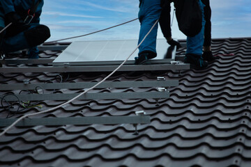 Installation of photovoltaic panels. Construction of the photovoltaic power plant of the family house.