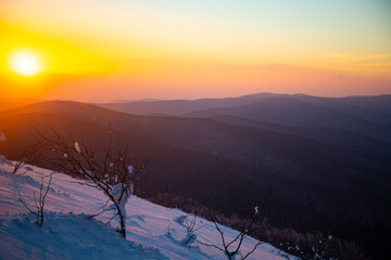 panorama of snow-capped mountains bieszczady at sunset, winter sunset seen from the top of the mountain wielka rawka © Lens Down Under