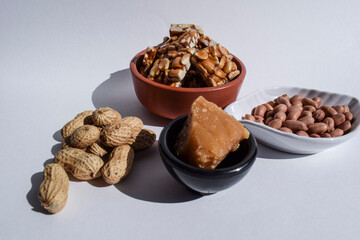Singhdana chikki or Peanut brittles. Sankranti food winter special made of groundnuts and jaggery. Ingredients of mungphalli chikki